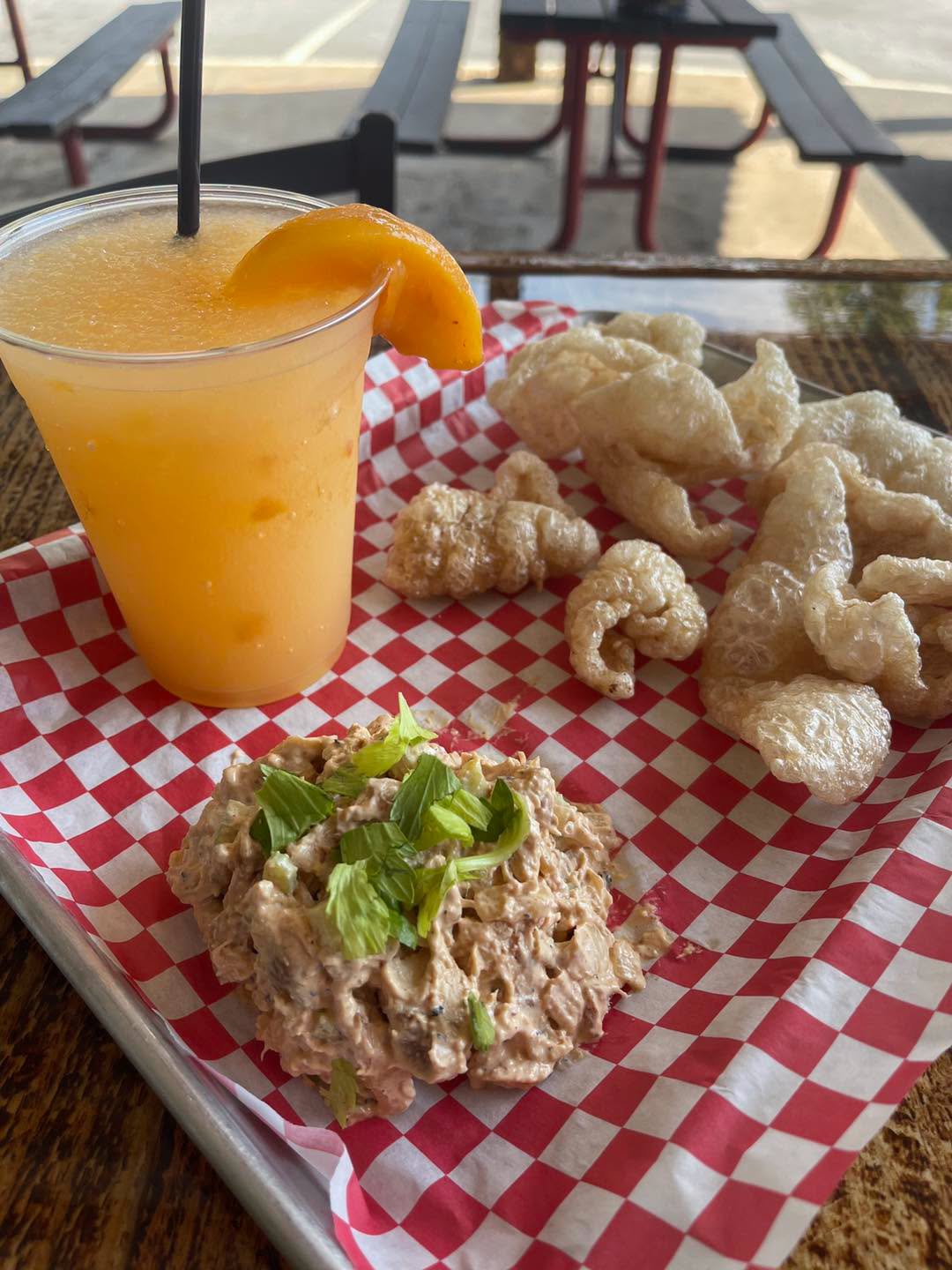 A fried entree, salad, and drink from PiNK PiG Southern BBQ
